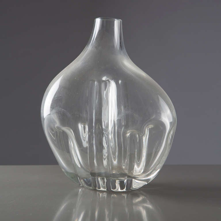 Outstanding Murano glass vase by Toni Zuccheri.
The piece is part of an experimental collection with crystal glass made by Zuccheri blowing the glass against strange shaped molds and worked then with tongs.