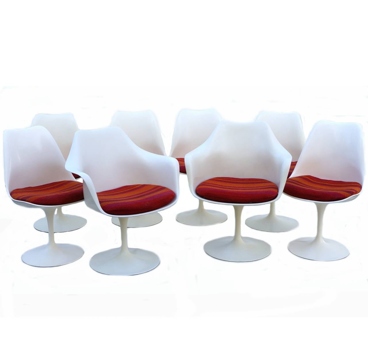 This is a set of eight Knoll tulip base chairs. Standard, non-swivel. Two armchairs, six side chairs. Six have the older 1960s label. Two of the side chairs are from the 1979. They measure approximately 31.5