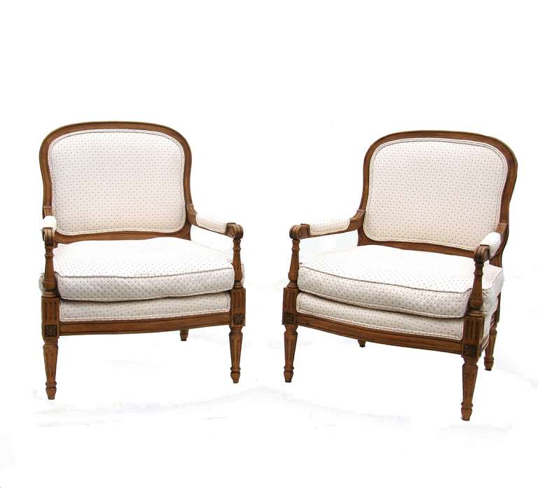 Pair of French side armchairs with rosettes.
