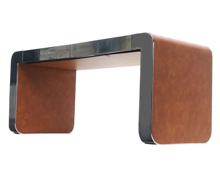 Polished steel and leather Gary Gutterman console table desk with two drawers in front.