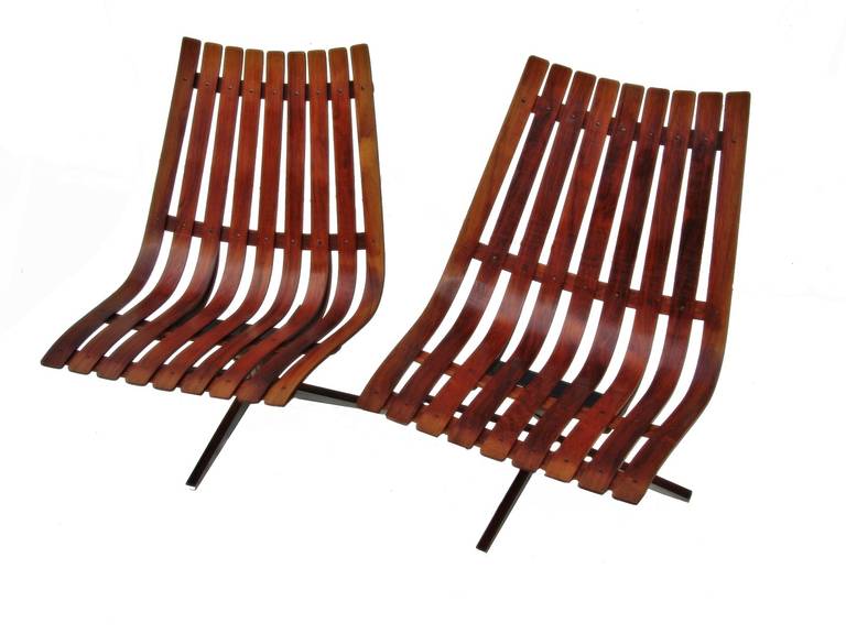 Pair of Hans Brattrud  Rosewood Swivel Lounge Chairs. Seat height is 16