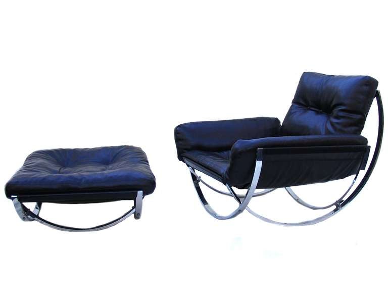 Stendig black leather lounge chair and ottoman. The ottoman measures 37