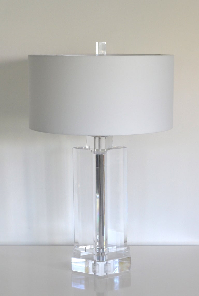 Masterfully crafted geometric form lucite table lamp. This Mid Century lamp is impactful in both design and dimension c.1960. Wired with chrome fittings and lucite finial. Shade not included.
