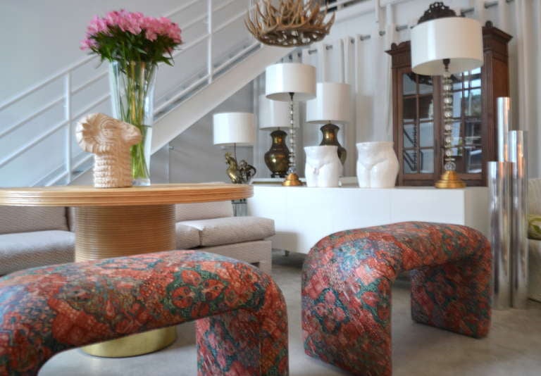 Pair of stunning Mid Century Modern upholstered benches in the style of Karl Springer, c. 1970's.  These waterfall edge stool are upholstered in a cotton geometric print fabric.