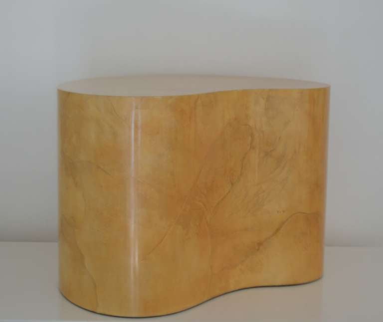 Stunning biomorphic form lacquered goatskin parchment side table attributed to Karl Springer, dated 12/1/77. This striking end table's design is based on free form lines and is substantial in size.