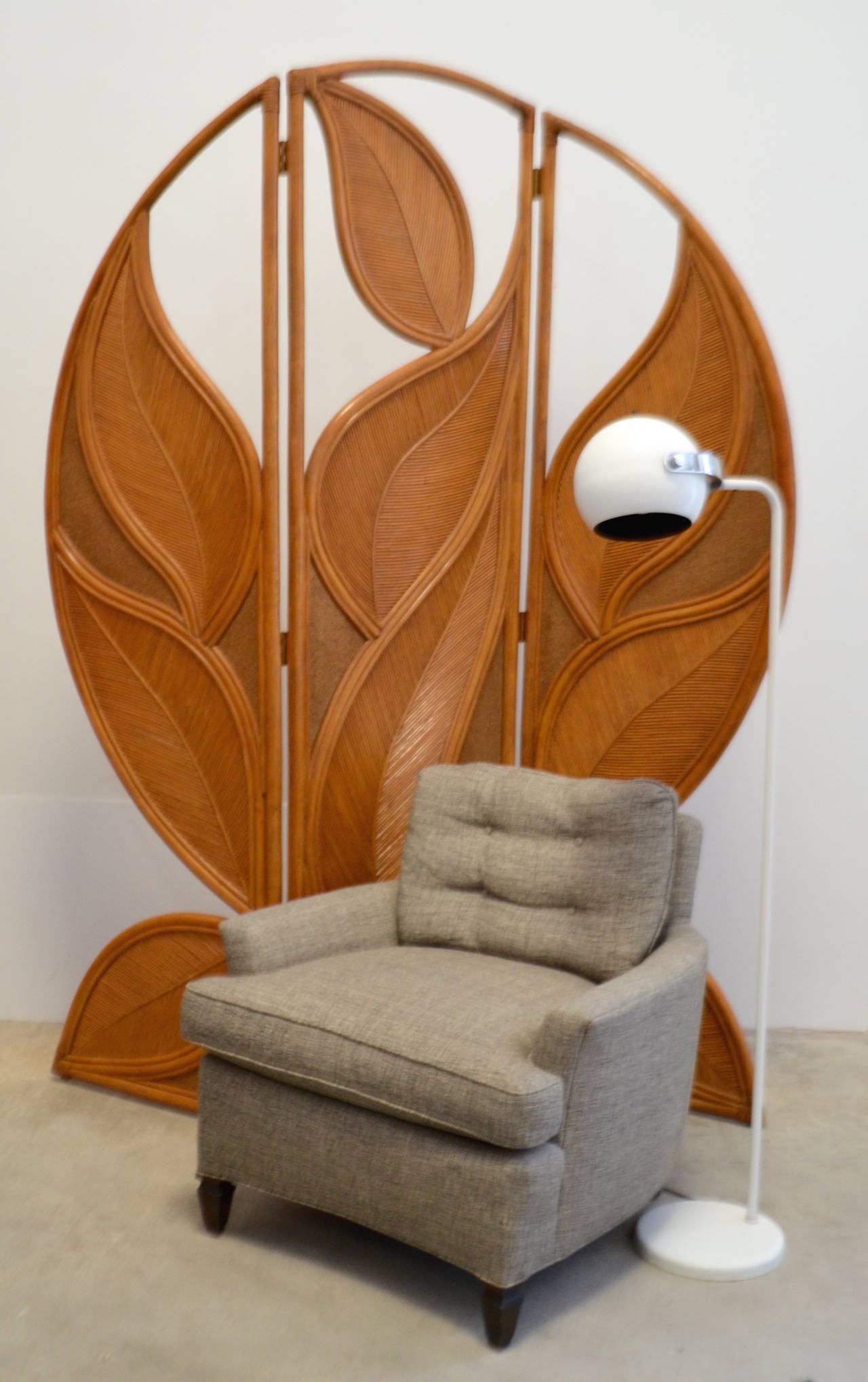 Incredible Art Nouveau inspired three panel folding screen, c. 1950s -1960s. This stunning sculptural room divider is designed of bent rattan, split reed and ground sandstone.  

Measurements:
Overall: 80