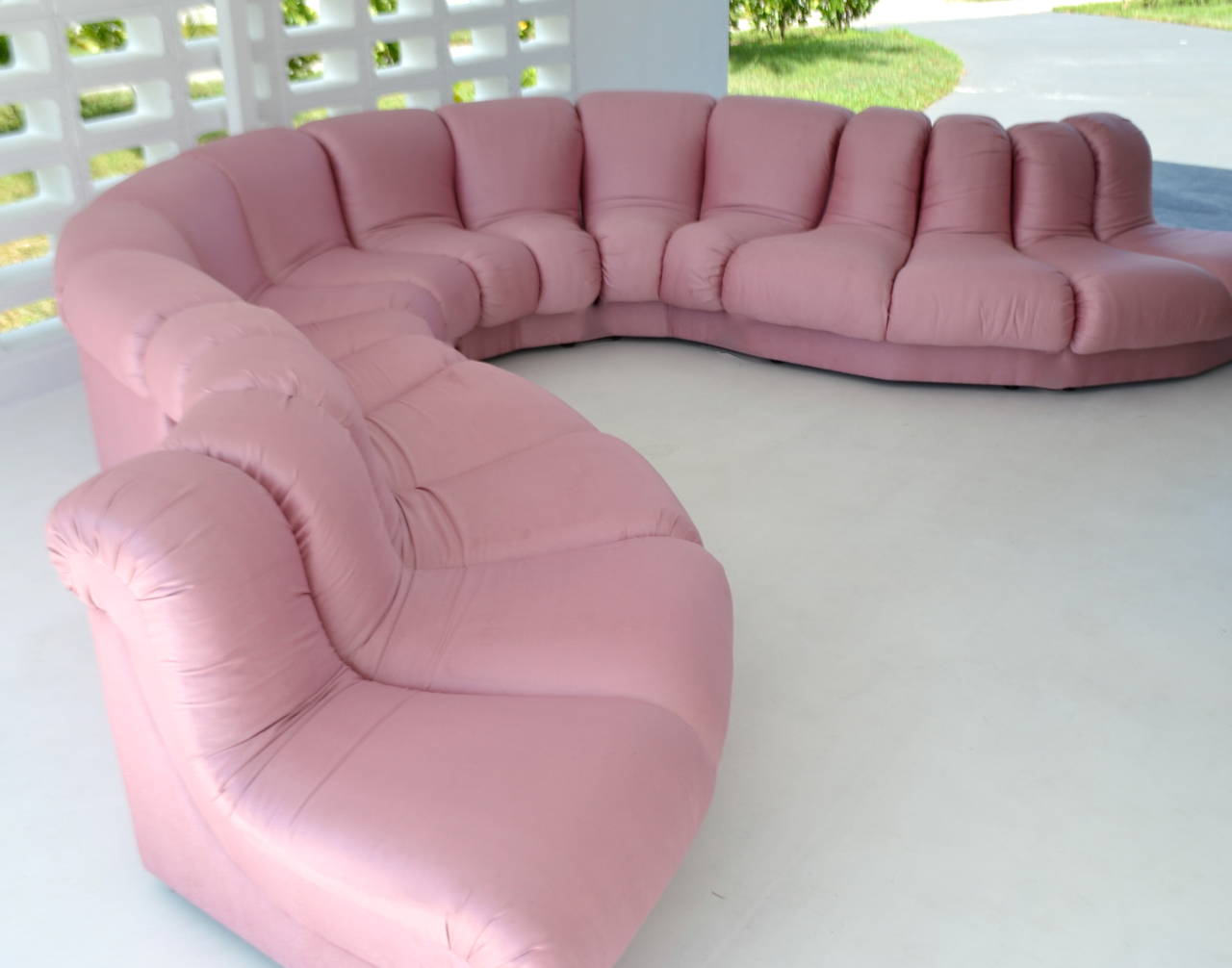 Exceptional eight-piece Post Modern sectional sofa by Preview Furniture Corporation, circa 1988. This glamorous sculptural modular sofa in the style of de Sede DS 600 Non Stop sectional Snake sofa, consisting of four convex and four concave curving