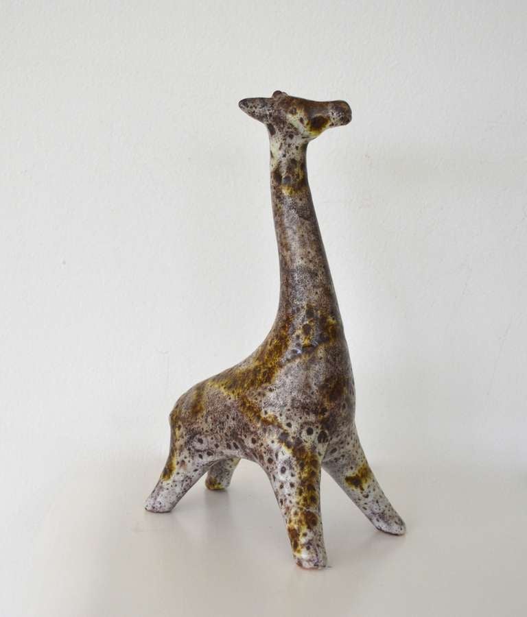 Mid - Century Modern sculptural ceramic giraffe fired in a mottled lava glaze in the style of Guido Gambone, c.1950s.
