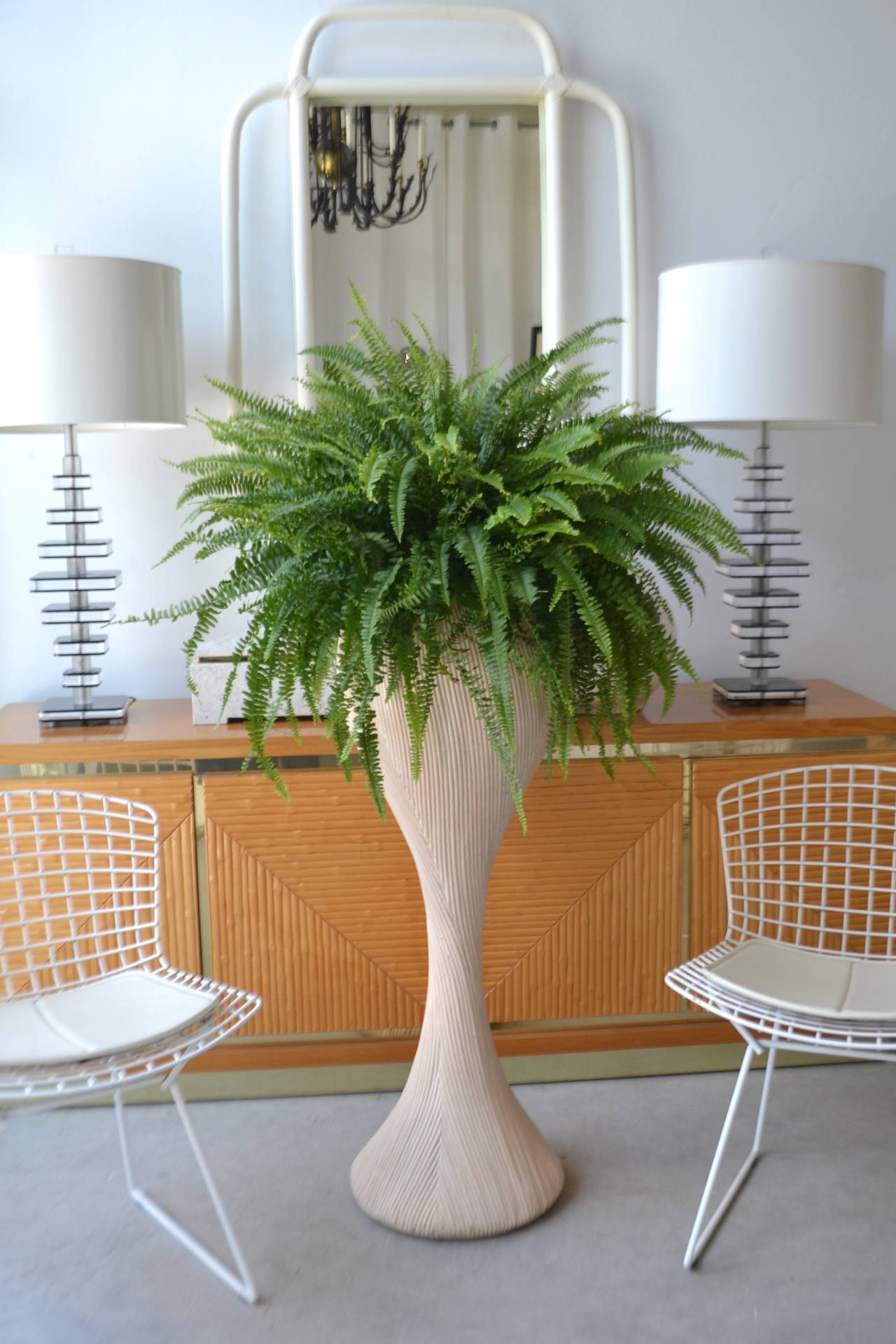 Sculptural cerused bent reed plant stand, c. 1970s -1980s. This substantial custom crafted pedestal / plant stand is exquisitely designed of applied cut reed strands over wooden form. 

Overall dimensions:

42.5
