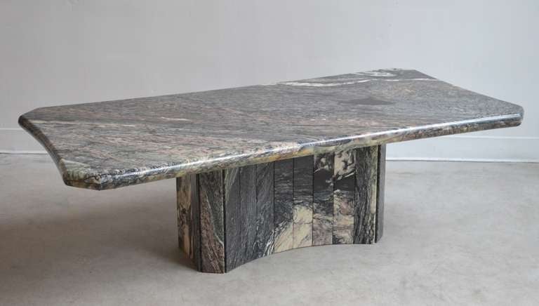 Stunning custom Italian marble coffee table, c. 1980s. This incredible Deco Modern cocktail table is architectural in form with a faceted marble design.