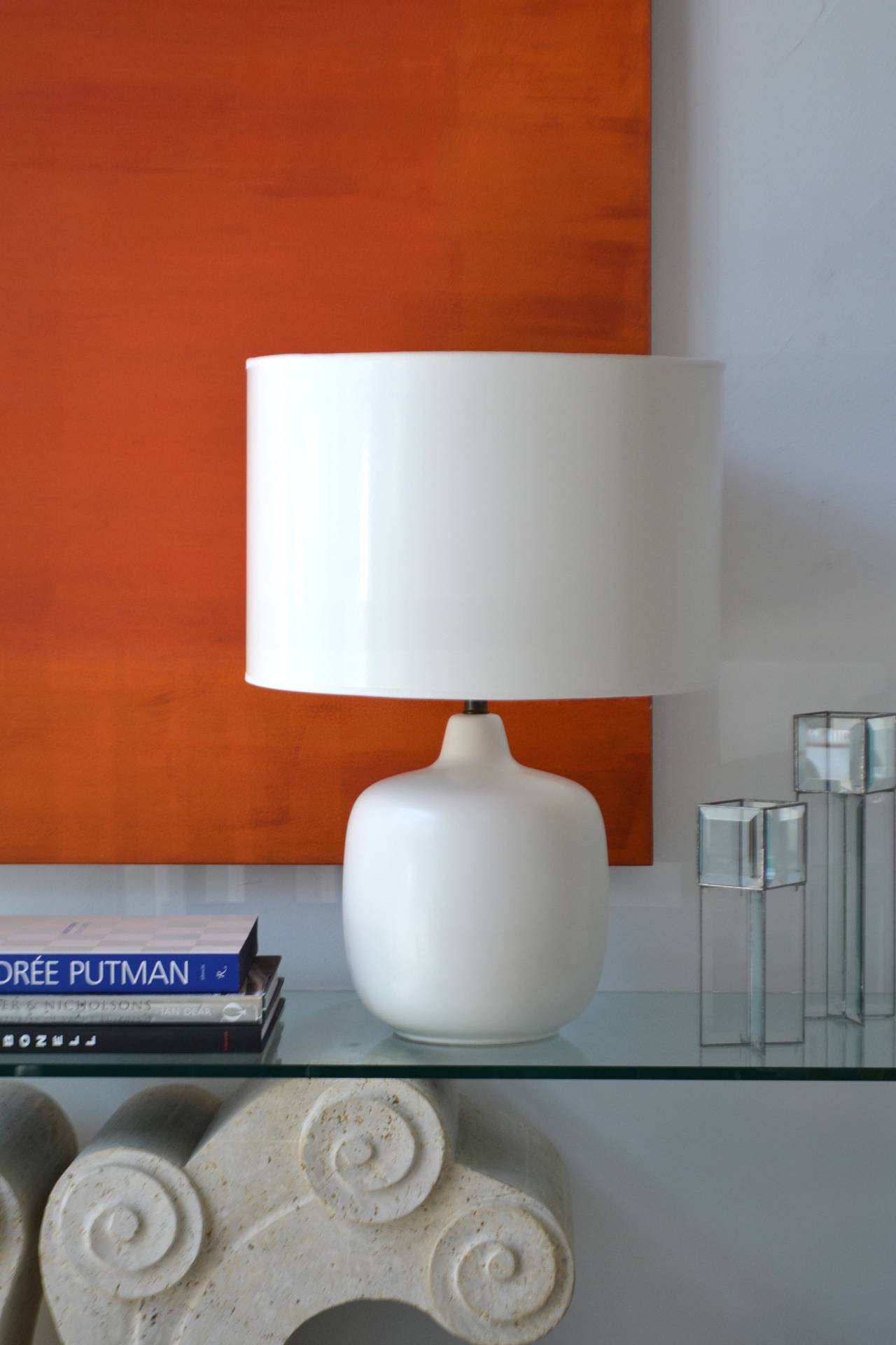 Striking white glazed ceramic table lamp, circa 1970s. This beautifully crafted egg shell matte glazed lamp is both graphic and organic in form. Excellent original condition. Sold without shade.

Measurements:

Form height is 13
