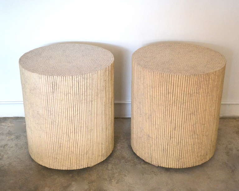 Pair of custom made lacquered reed side tables, c. 1960s - 1970s. These exquisite Mid Century Modern night stands are made of intricately cut reed. Each drum table / pedestal has been hand painted with a faux marble finish and is in original
