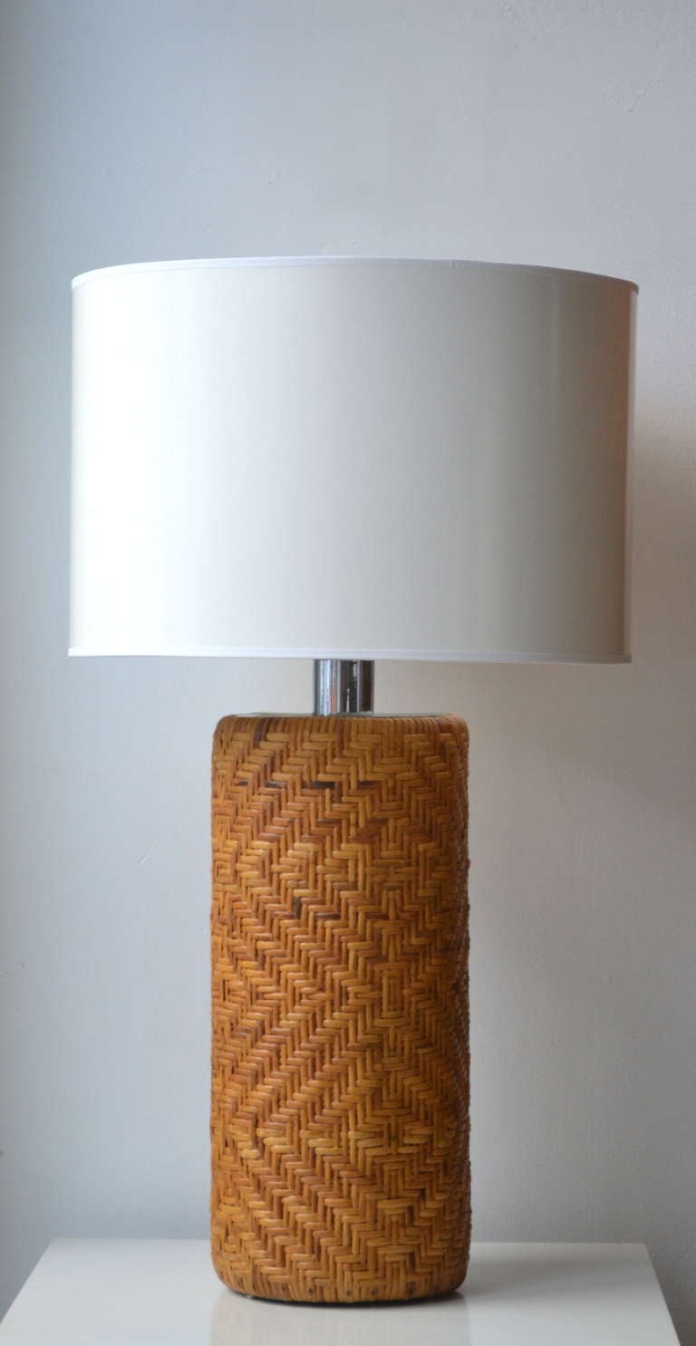Striking Mid Century Modern woven reed cylinder form table lamp, c. 1970s. This stunning lamp is wired with chrome fittings. Shade not included.
Measurements;
33