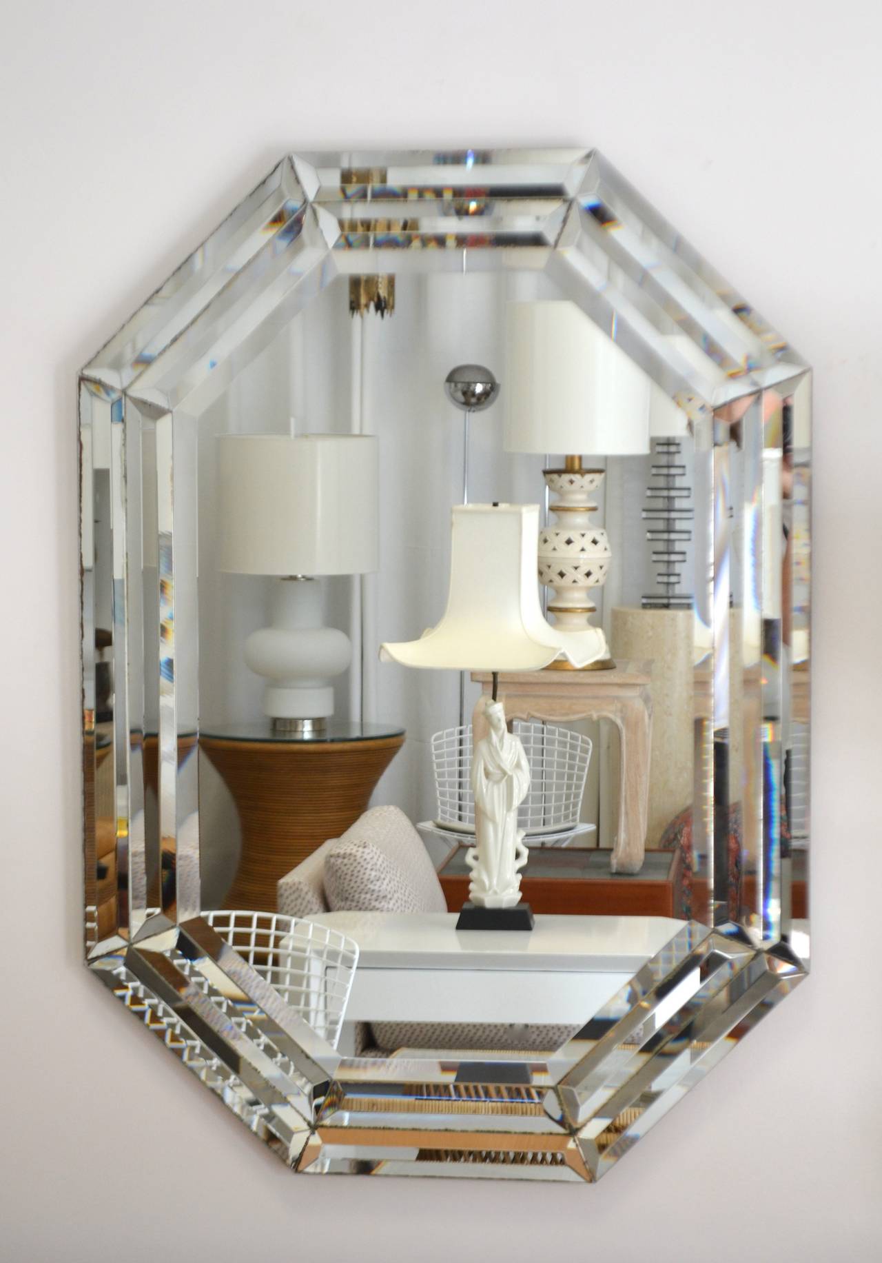 Glamorous Hollywood Regency octagonal shaped wall mirror with 4