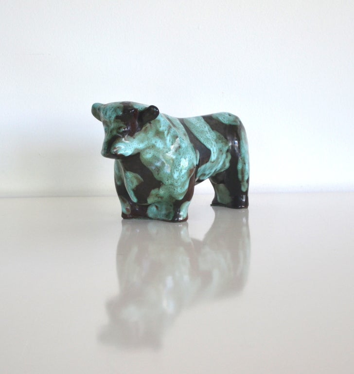 Rare and unusual hand thrown ceramic glazed bull by Marianna Von Allesch c.1950s - 1960s. This incredible Mid Century aqua and ebony matte glazed terra cotta bull sculpture is organic in form and signed on the bottom. The bull is in original pristine