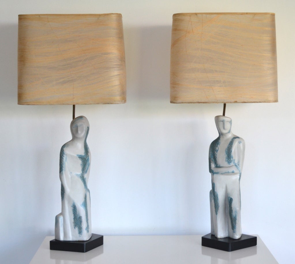Pair of rare Cubist inspired ceramic figural form table lamps mounted on ebonized wood bases by Marianna Von Allesch. c 1950s. These decorative sculptural lamps are signed on the back. Shades not included.
Please view our entire