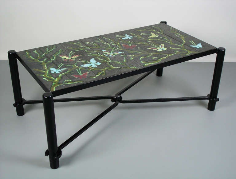 Coffee table in ceramic and black lacquered iron. Top set up with eight tiles inset in an iron frame.