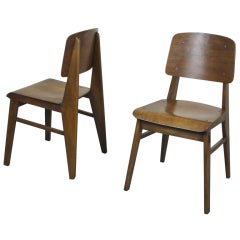 Two beech chairs by Jean Prouvé