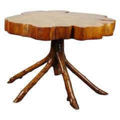 a tree trunk gueridon table