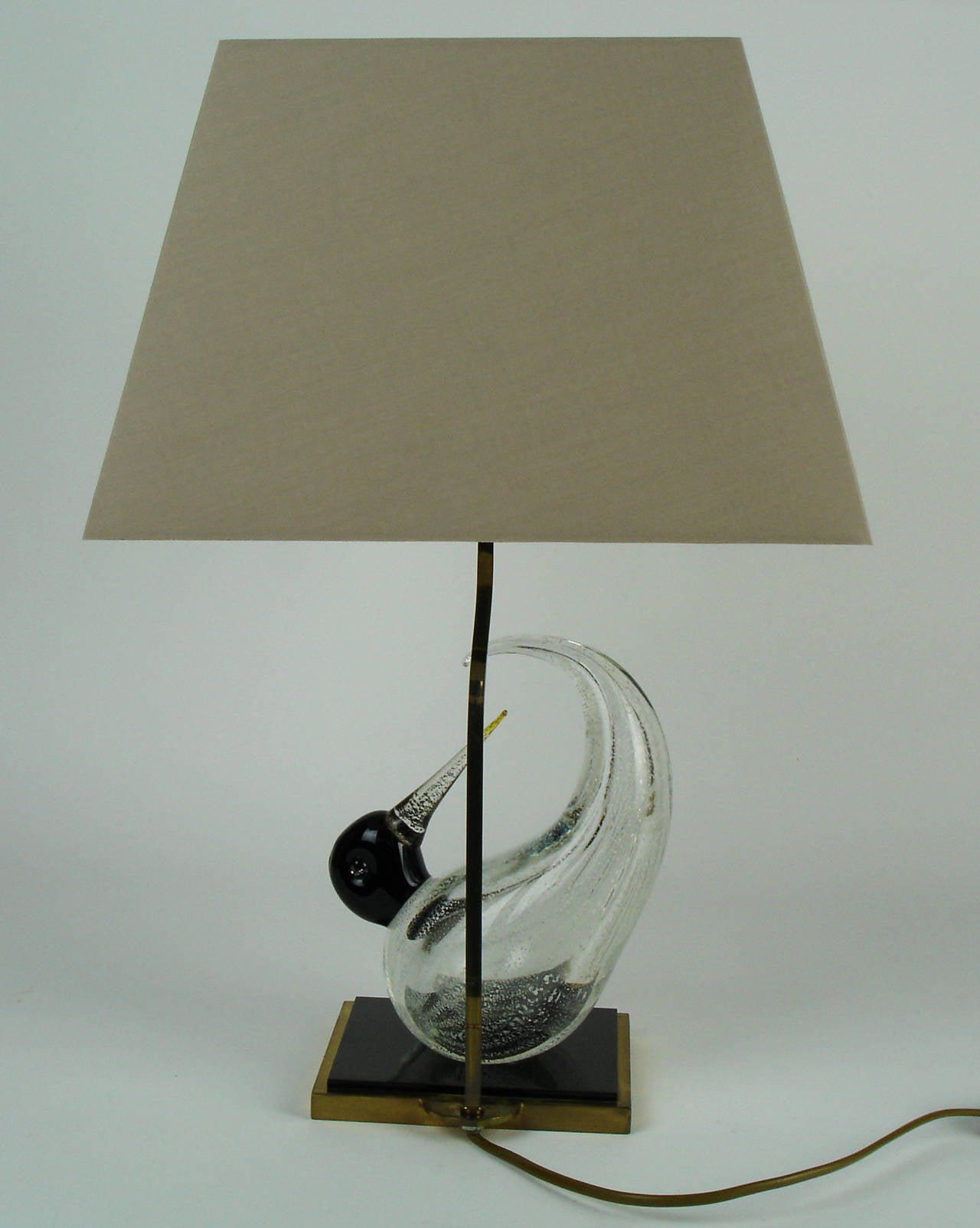 A Table lamp with a brass & black plexiglass fitting and a hand blow glass Murano Venini bird.New lamp shade.