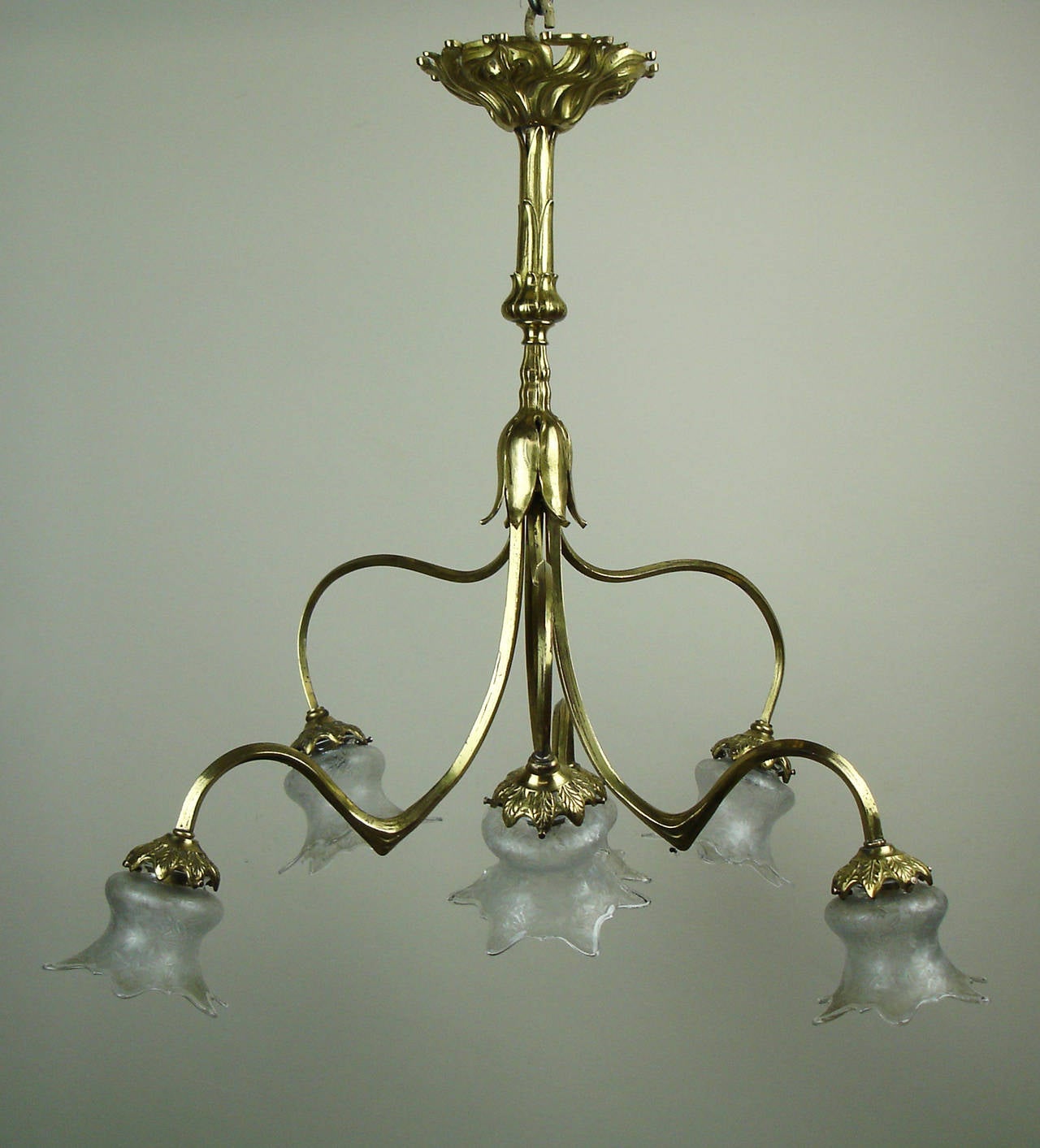 A floral Art Nouveau gilt bronze & brass chandelier with six elegant   Baccarat  crystal shades.