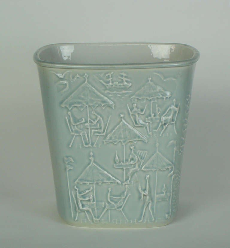 A porcelain ice bucket or vase in celadon glaze with sea side scenes patterns.Signed and numbered 3/50