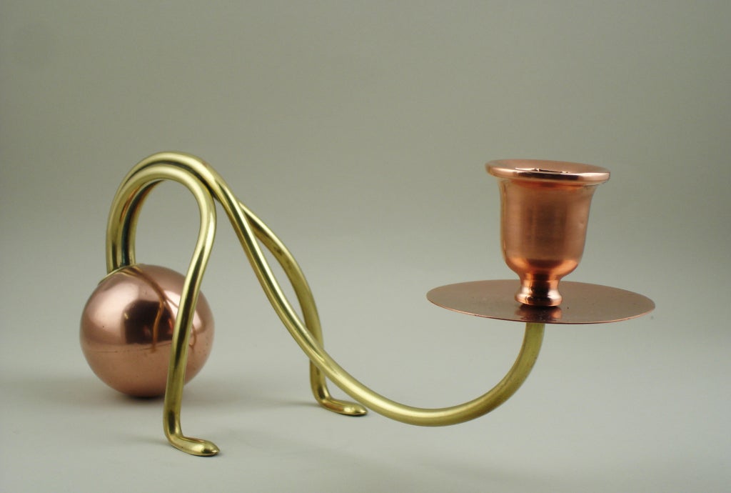 2 copper & brass candlesticks with an ovoid counterweight,an S shape stem flanked by two feet supporting a sconce