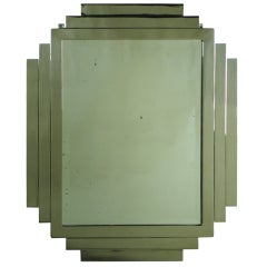 A modernist nickeled bronze mirror attributed to Jacques Adnet