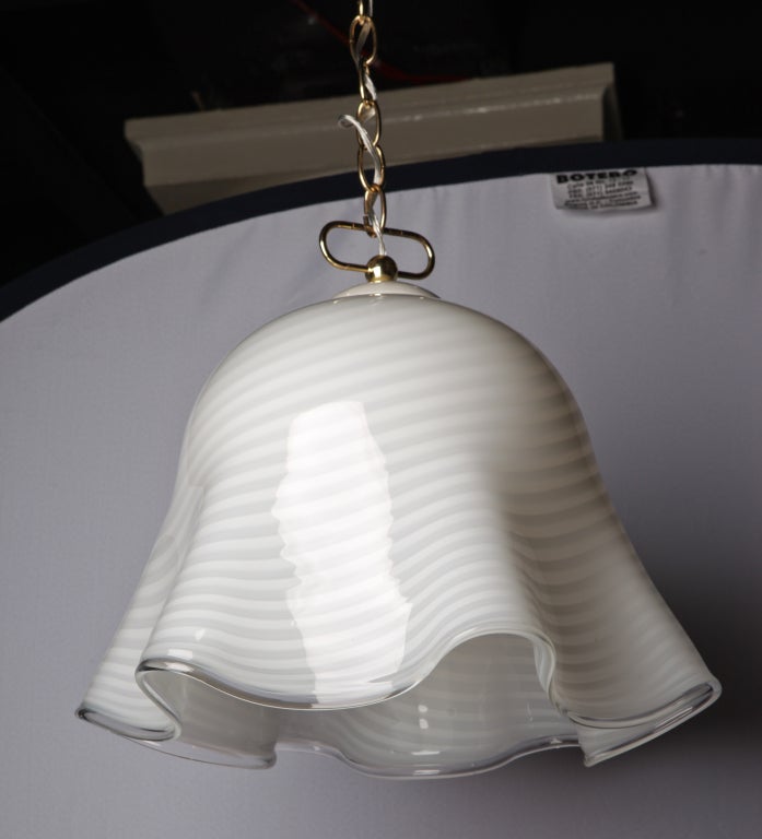 Glamorous Murano pendant in waves of white-on-white striped glass. Subtle and simply lovely.

Note on measurements: Glass portion alone is approximately 13