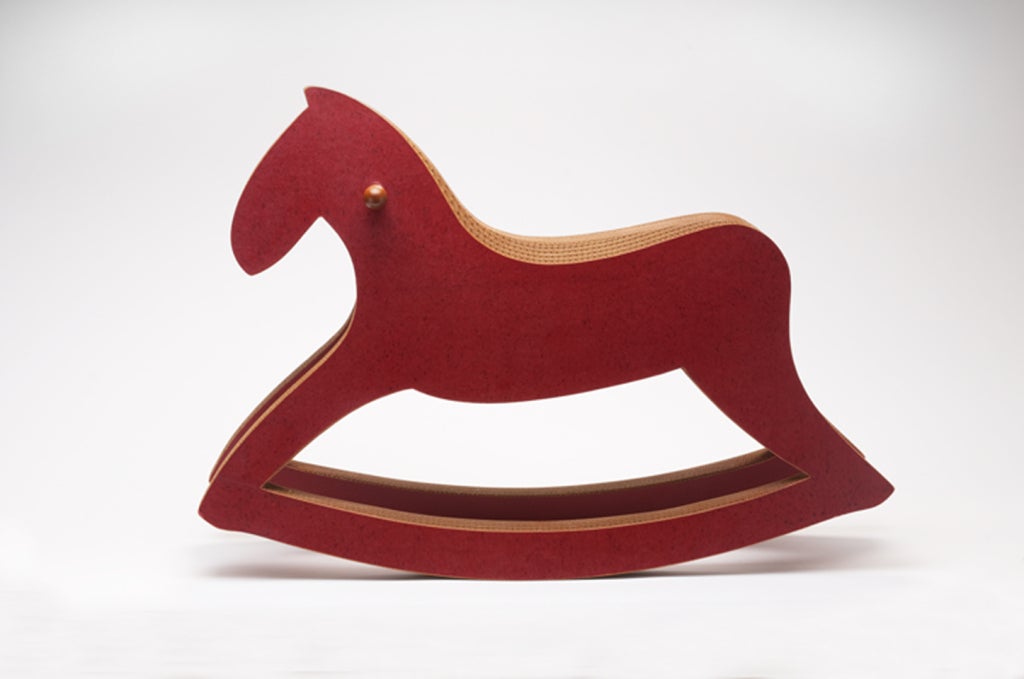 Rocking horse made from laminated cardboard with a lacquer surface, designed to be both sculptural and functional. Number 7 from and edition of 25.