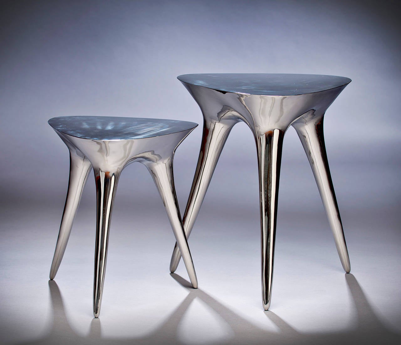Chrome 8 Tables by Timothy Schreiber are stainless steel end tables polished to a mirror finish. 

Chrome eight tables are from an edition of 12. 

Timothy Schreiber initially trained in cabinet making in Germany before studying architecture and