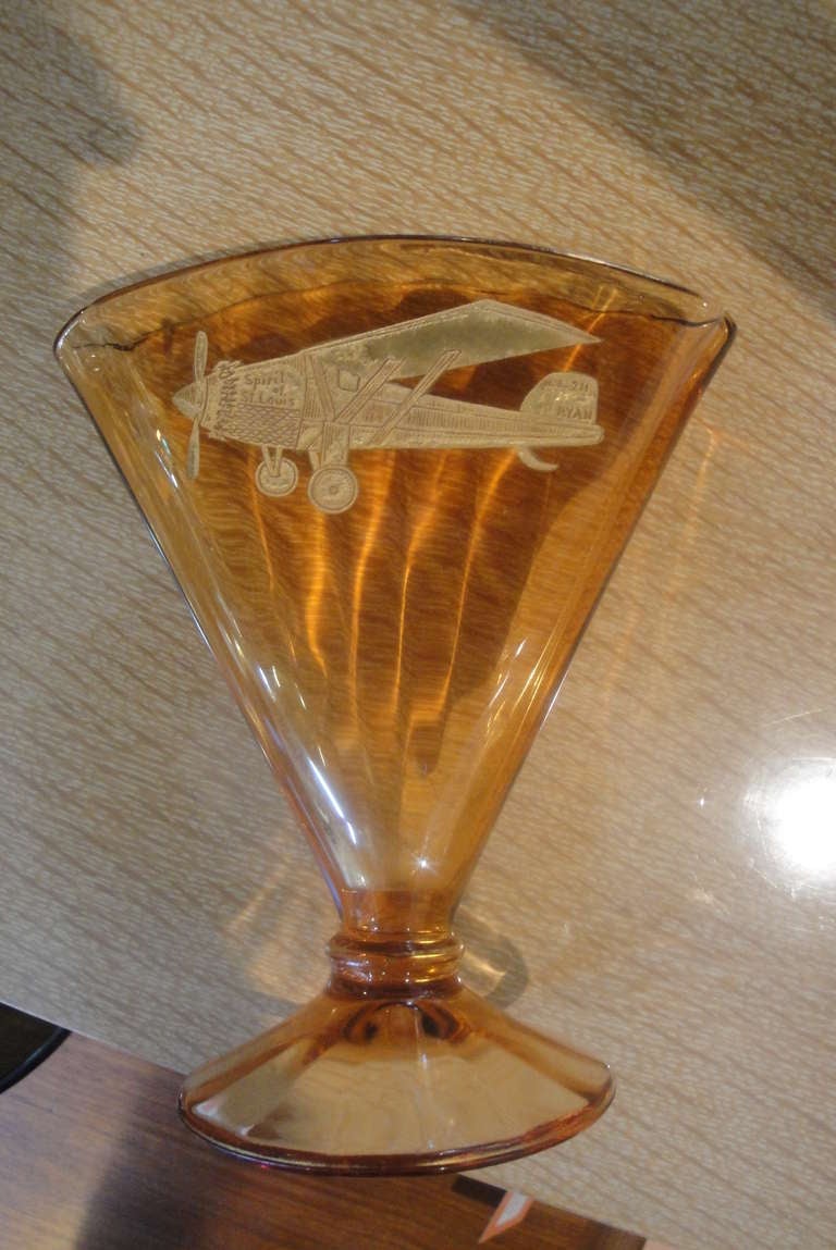 A period Art Deco etched glass vase featuring the Spirit of St. Louis airplane, circa 1920s. Souvenir or memento of the famous Charles Lindbergh Cross-Atlantic flight in 1927. Attributed to Cambridge or Fostoria Glass. A rare decorative item and