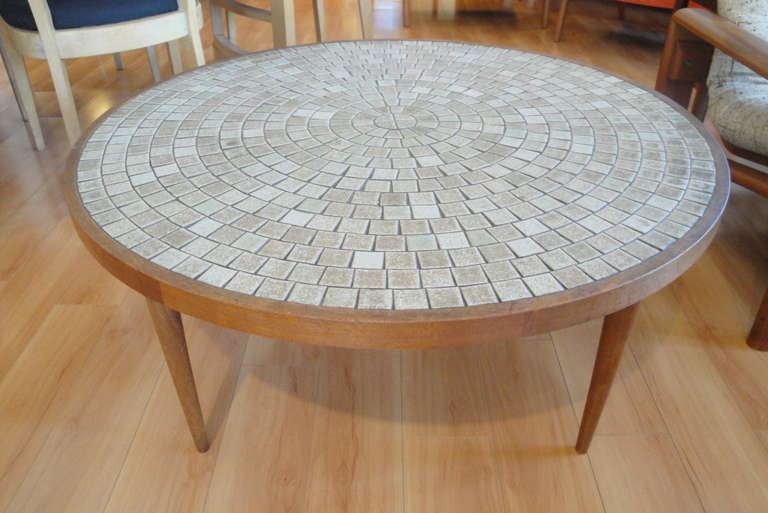 Gordon Martz round sunburst tile top coffee table with peg leg construction.