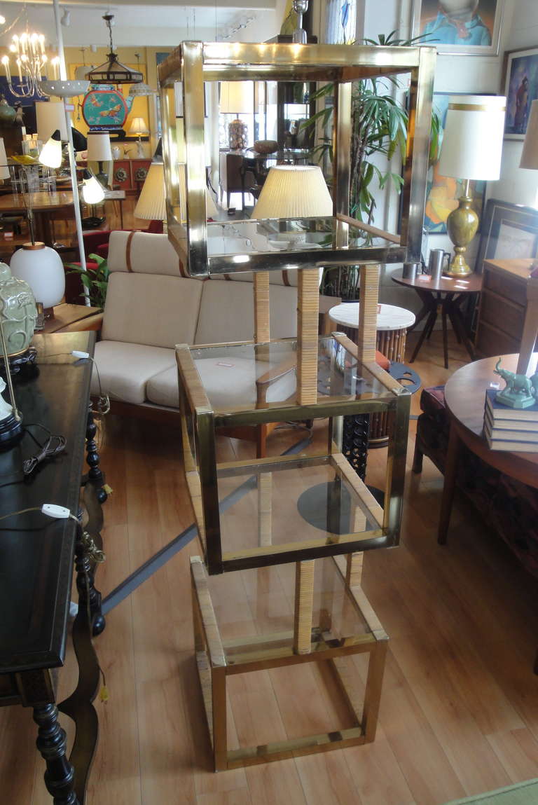 Here is an unusual brass, glass and wicker cubical curio shelf from the 1970's.