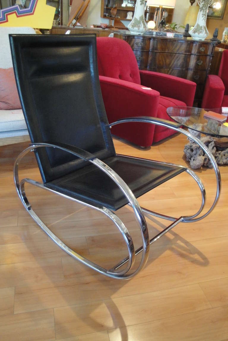Graceful leather and chrome rocker in the style of Milo Baughman. Over-sized form allows for exceptional comfort.