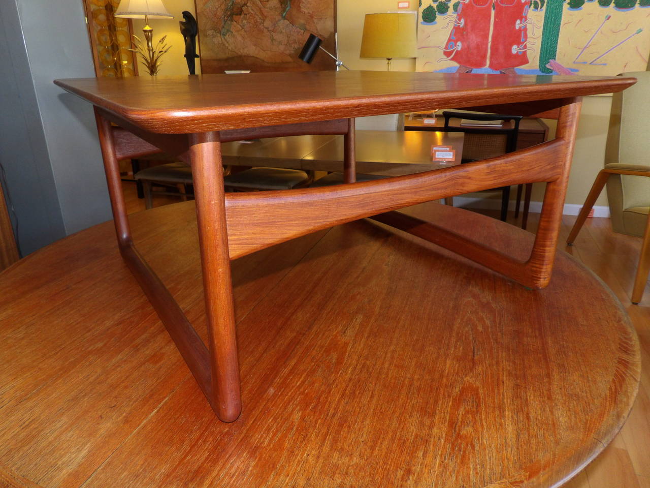 A Fine, solid teak, Danish end table designed by Peter Hvidt. Retains John Stuart label. Would also work well as a coffee table.