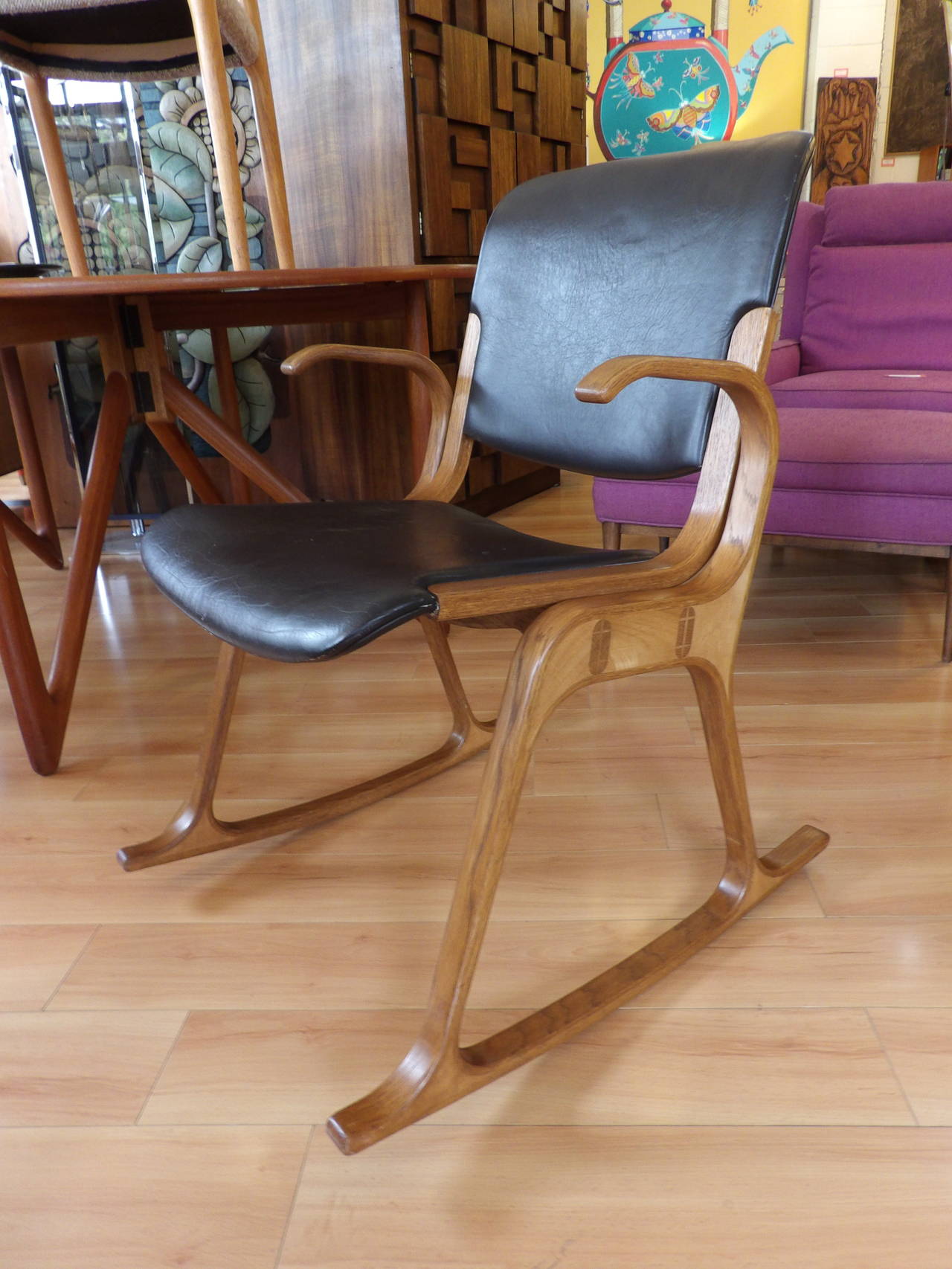 Unique steamed wood and leather Mid-Century Modern rocker created in the style of Mitsumasa Sugasawa. Fine detail to joined wood, leather upholstery. Unknown maker and designer.
