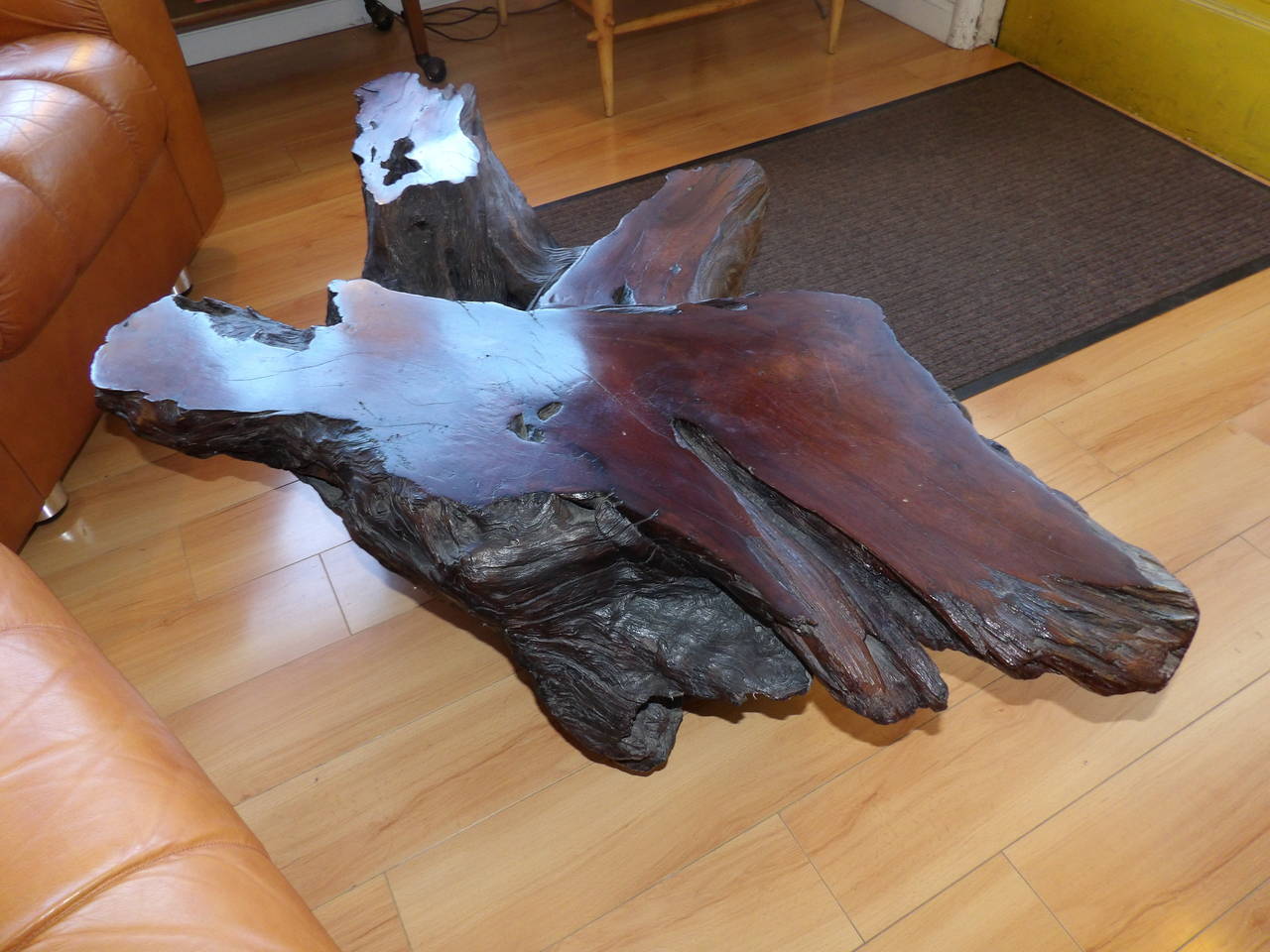 An organic California Redwood live edge driftwood coffee table. Notice multilevel design with beautiful burl-wood to flat surfaces. Rests on 3 castors for easy moving.