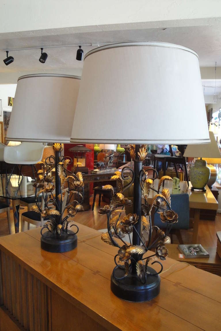 Classic Italian gilt metal and painted steel floral table lamps. Excellent original painted and gilt finish. Three-way sockets. Lamp shades included.