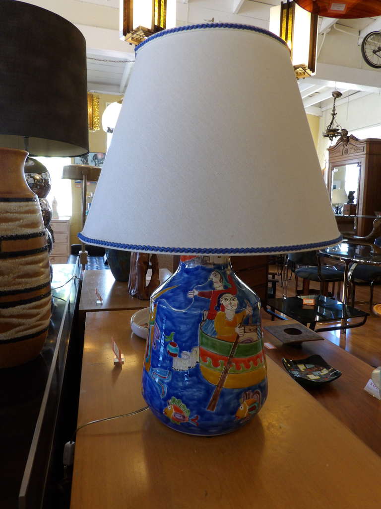 A hand painted ceramic lamp with a Picasso inspired theme by Giovanni DeSimone, Palermo, Italy. Leonard Foss custom lampshade included. Ceramic base measures 9.5
