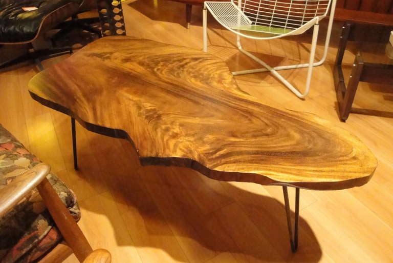 Beautiful figured grain in this striking free form coffee table.
