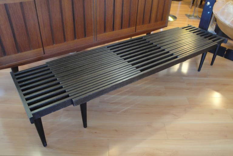 Adjustable slat bench expands from 55