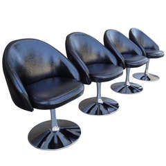 Four Chrome Tulip Base Swivel Chairs