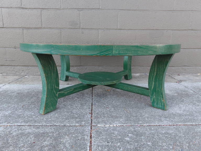 A Paul Frankl cerused oak circular coffee table with a glass top. Circa. 1948. Crafted in solid oak with an unusual, original, custom green cerused finish. Bold industrial Modern design. Light wear throughout.
