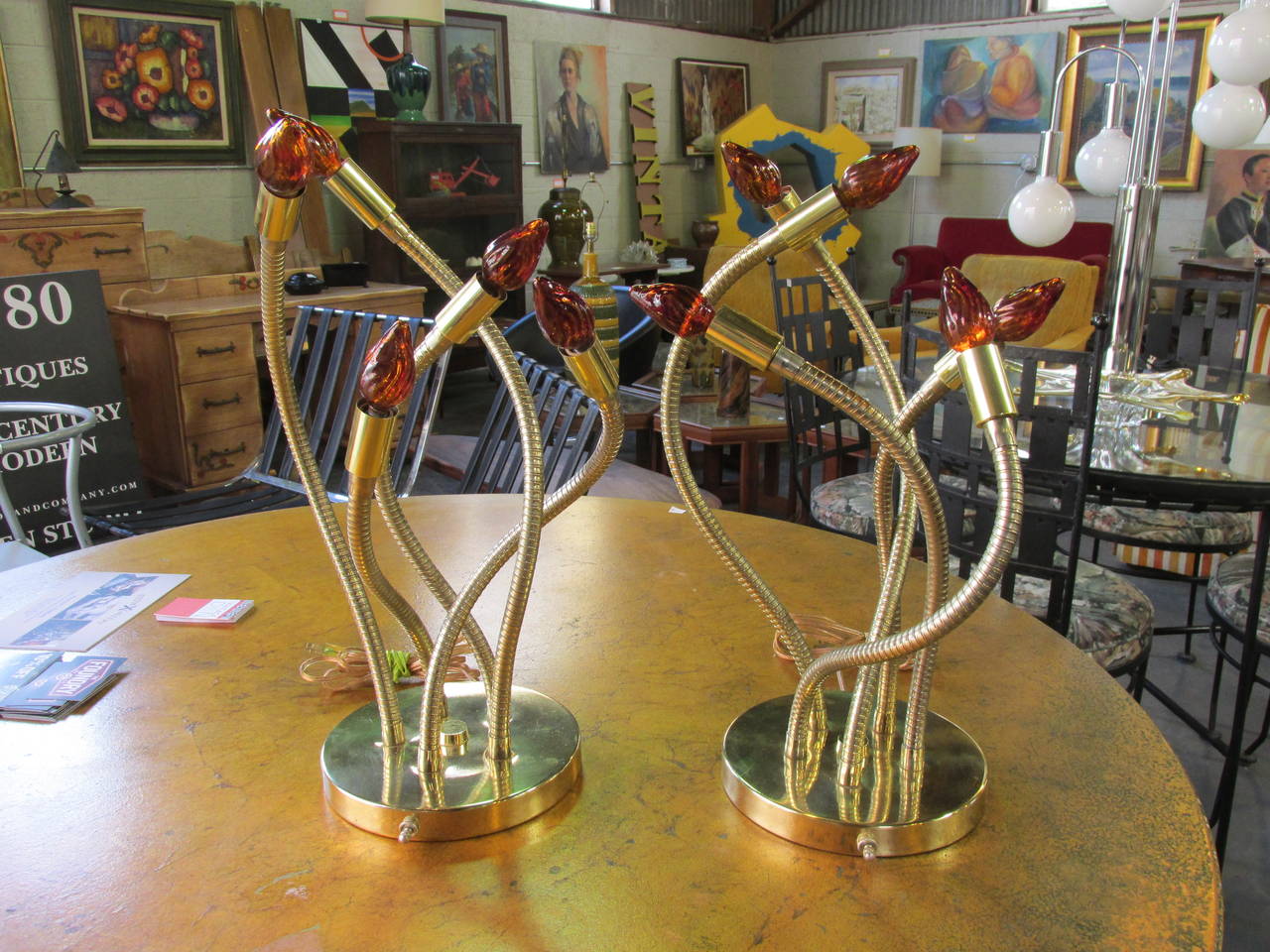 Extraordinary pair of 1960s modern, octopus like, articulating brass table lamps. A variety of positions or light bulbs can be applied. I have attributed these lamps to Robert Sonneman as an associate informed me he had seen this lamp with its