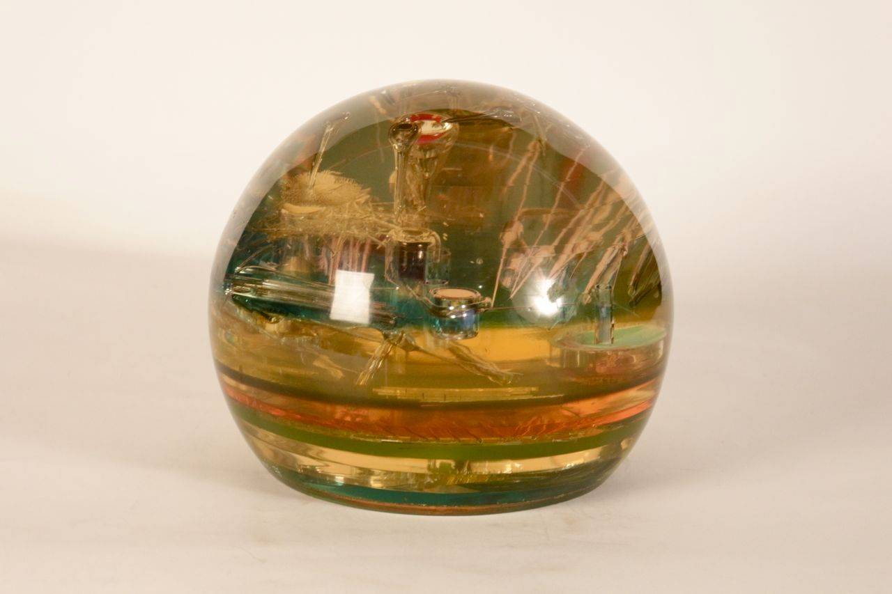 Fantastic resin sculpture with inclusion.
Signed and dated.