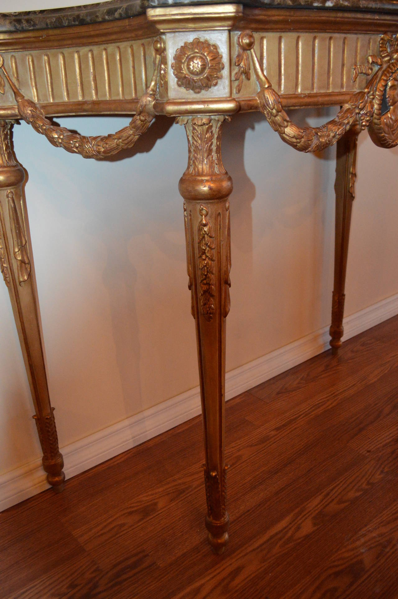 Gold Leaf Pair of Louis XVI Style Painted and Gilt Consoles