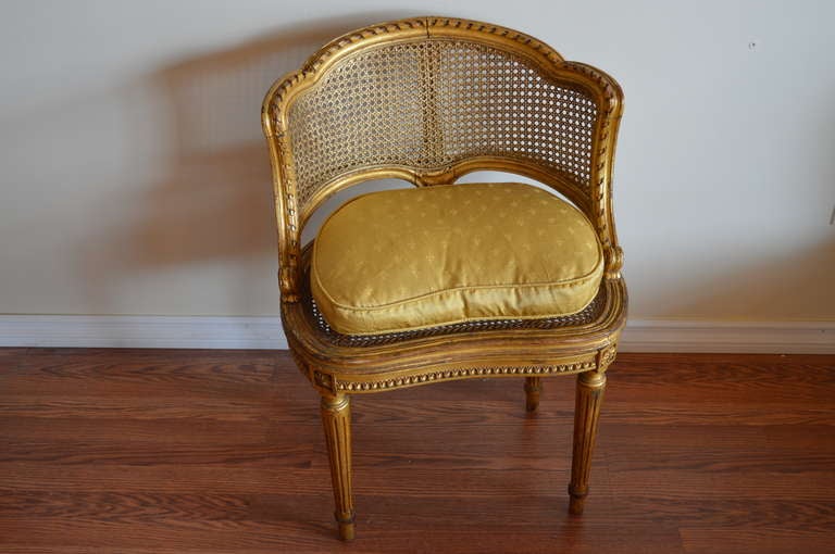 Charming Louis XVI style caned side chair. Louis XVI style hand carved ribbon on edge of back and pearling on side of apron. The silk 