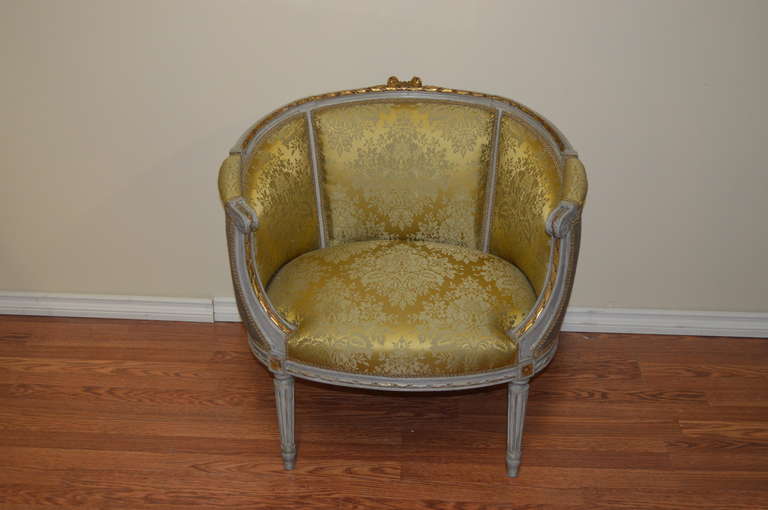 Very eleqant pair of Painted Louis XVI style marquises, large bergeres.
There are gilded details; the seat, side and back is upholstered in a gold and grey silk damask and the back in a plain grey raw silk.