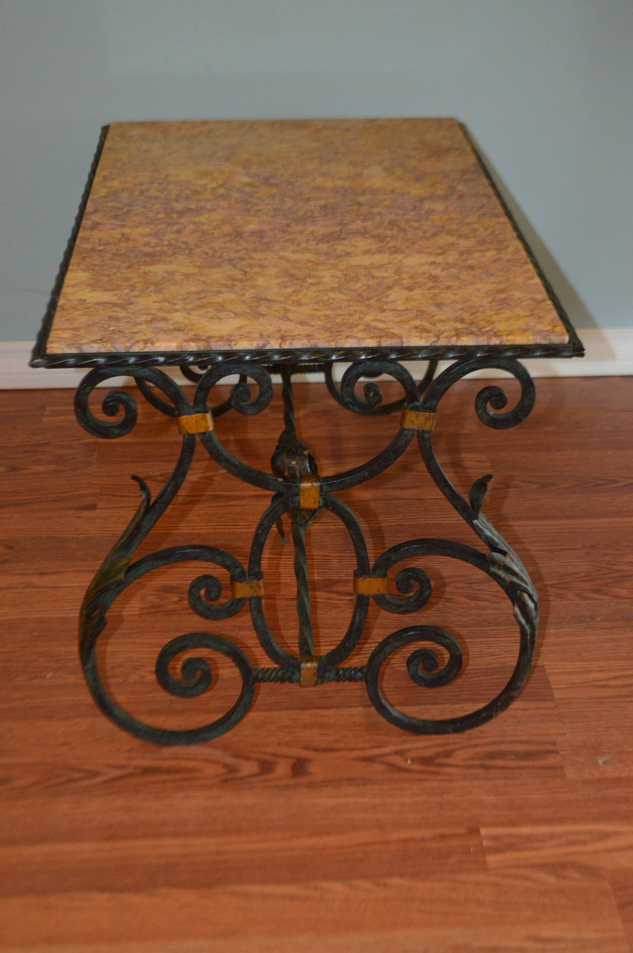 Belle Époque Belle Epoque wrought iron coffee table with marble top.